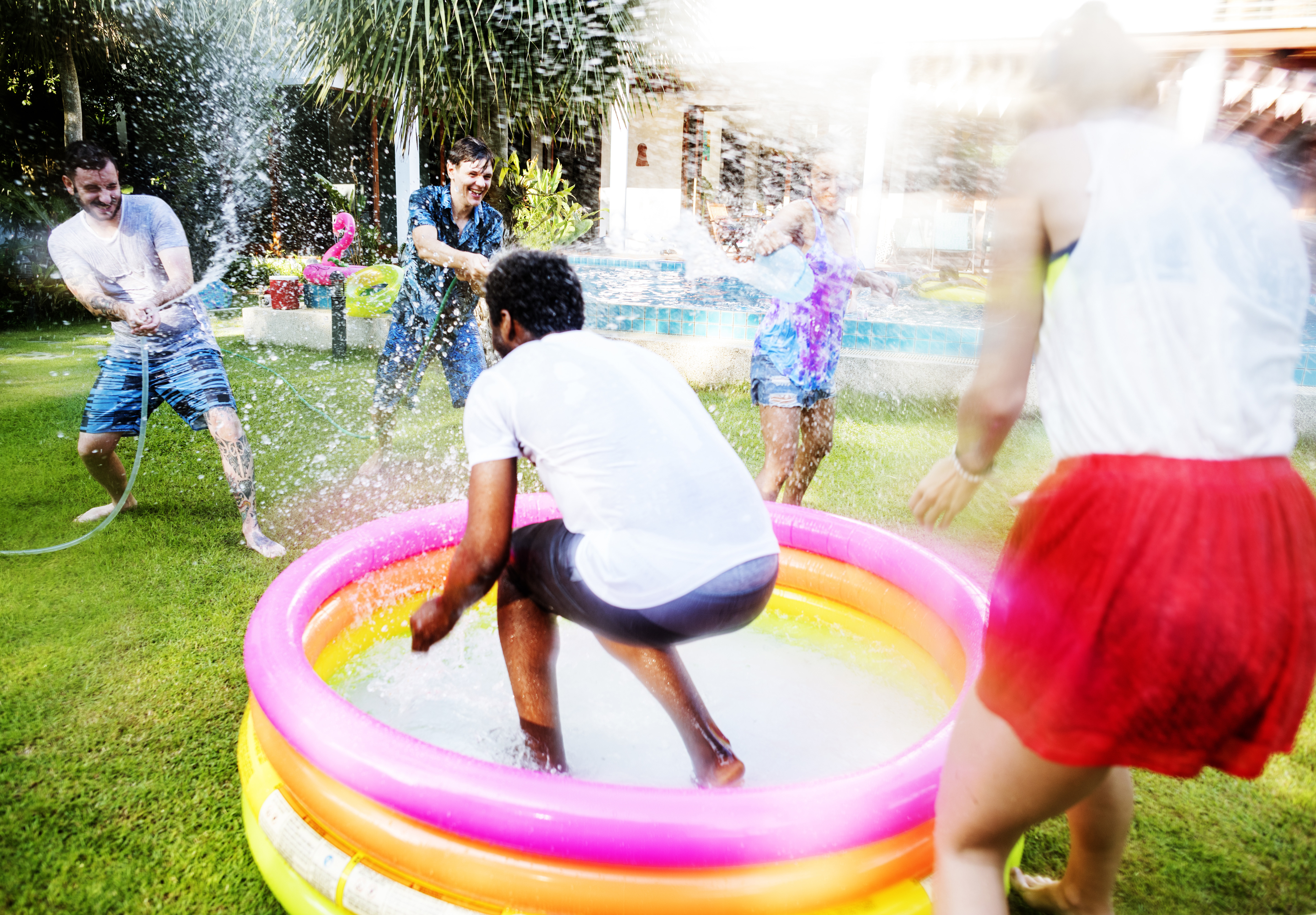 People Outside Having Water Fight