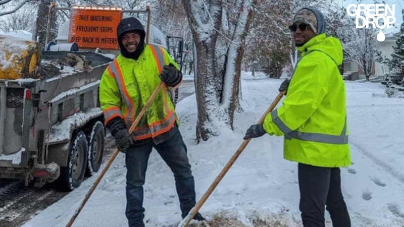Green Drop employees clearing up after a snow storm