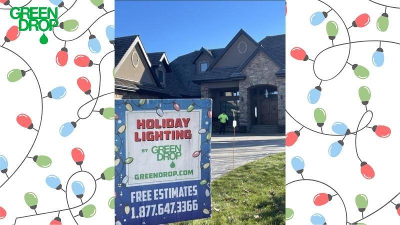 Green Drop holiday lighting sign outside a house, framed by illustrated Christmas lights