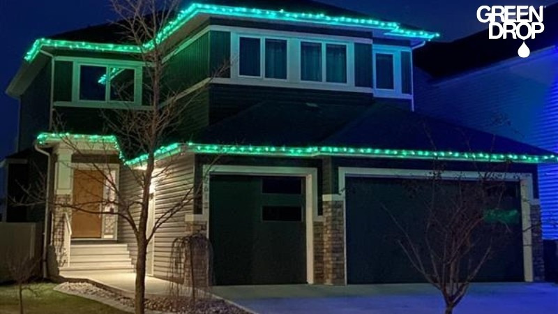 A house decorated with Green Drop’s professional green LED roofline lights, showcasing a clean and efficient holiday lighting design.