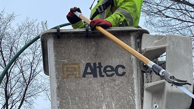 Green drop worker on a lift