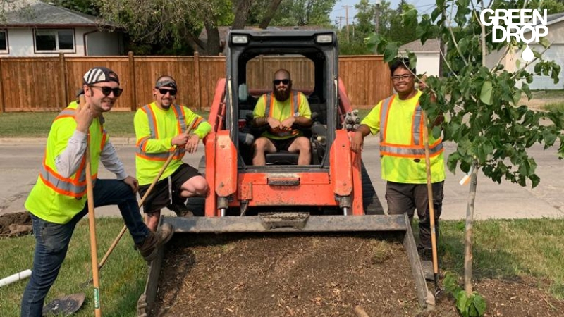 Green Drop workers in Red Deer using machinery