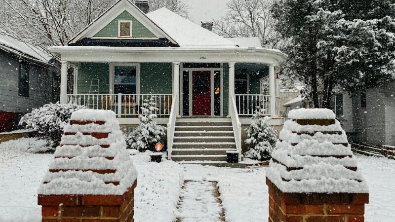 Snow Covered Lawn And House
