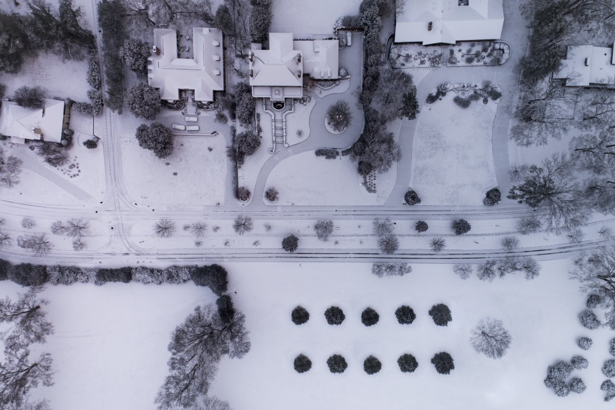 Aerial view of a neighborhood covered in snow